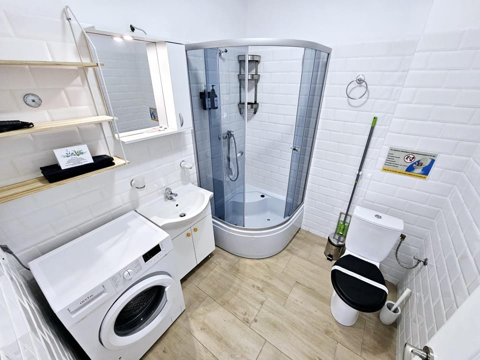 Shower, Toilet, Bathroom, towels, washing machine, dryer