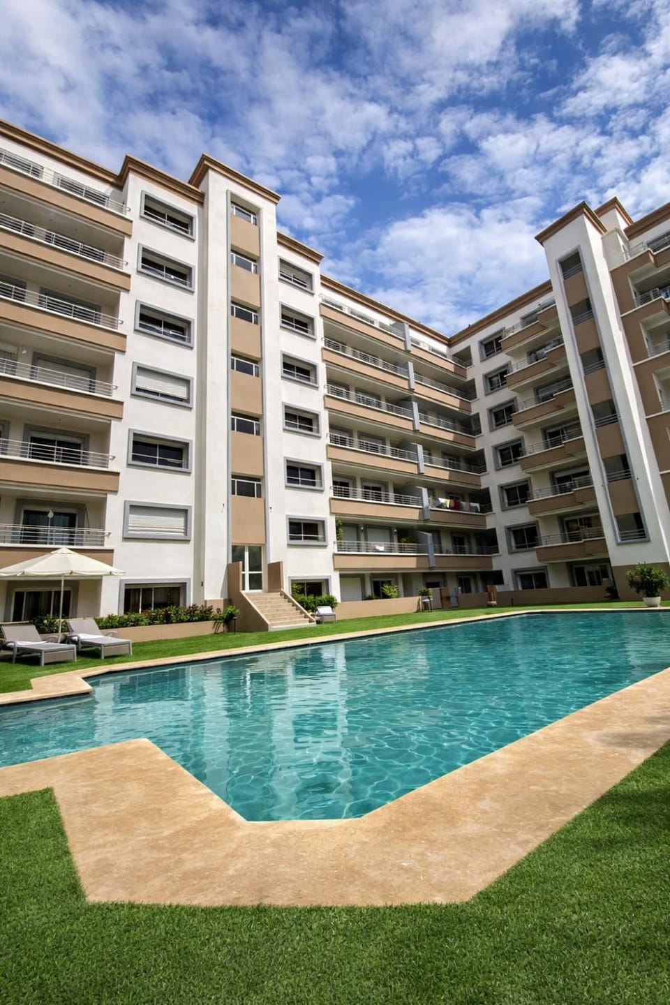 Property building, Day, Pool view, Swimming pool, sunbed