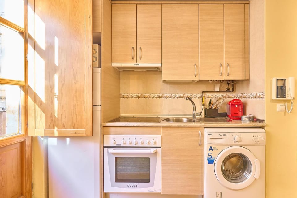 Kitchen or kitchenette, oven, stove, toaster, washing machine