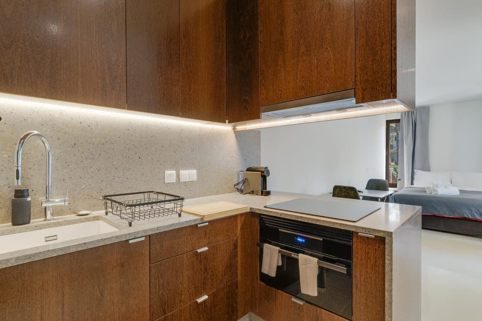 Kitchen or kitchenette, dishwasher, oven, stove, toaster