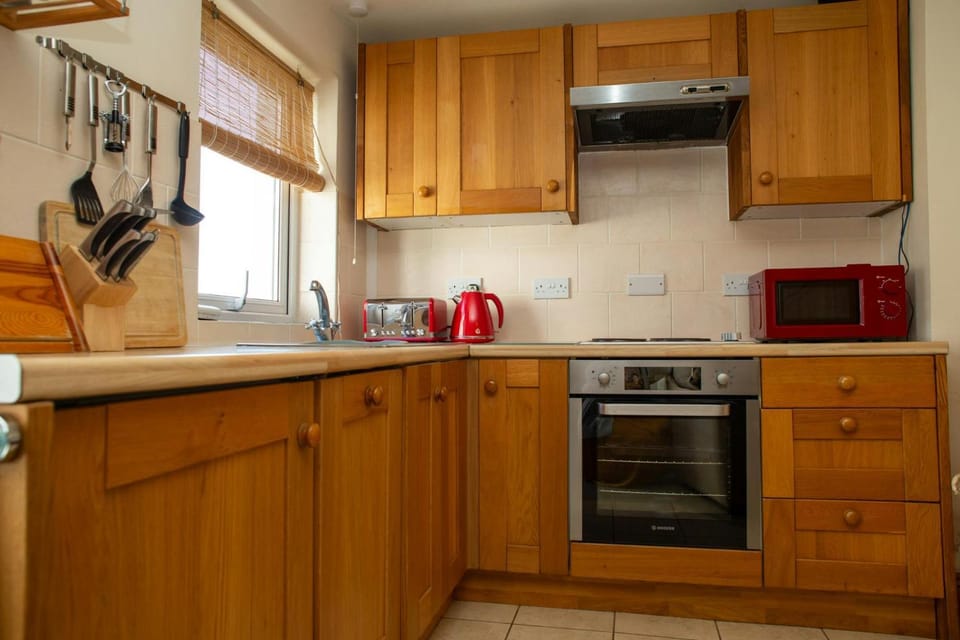 Kitchen or kitchenette, microwave, oven, stove, toaster