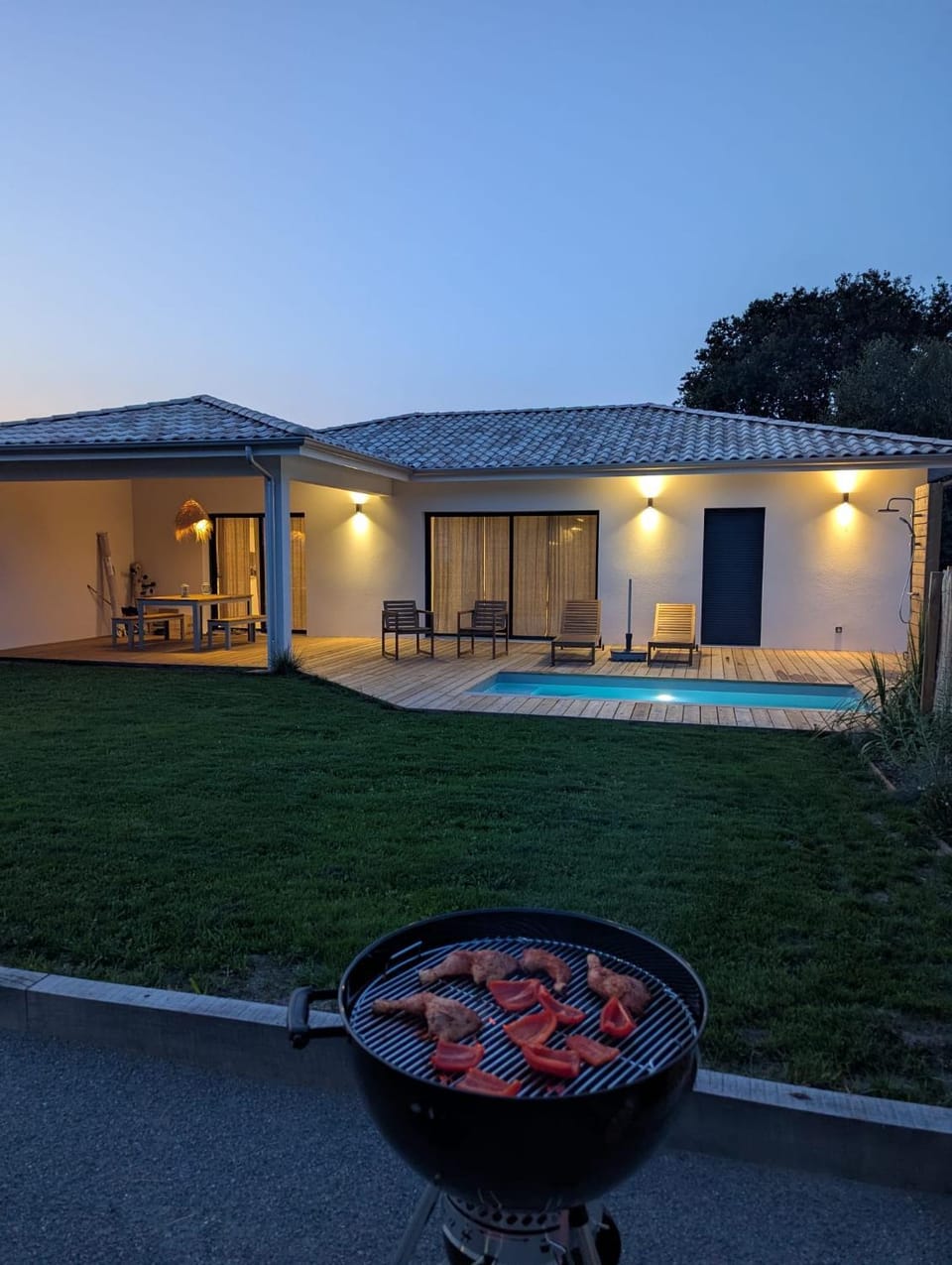 Property building, Patio, Night, BBQ facilities, Balcony/Terrace, Pool view, Swimming pool