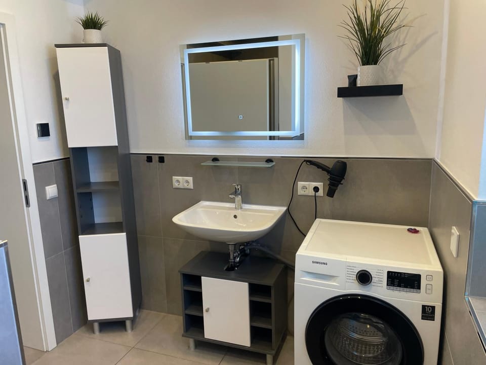 Bathroom, washing machine, dryer