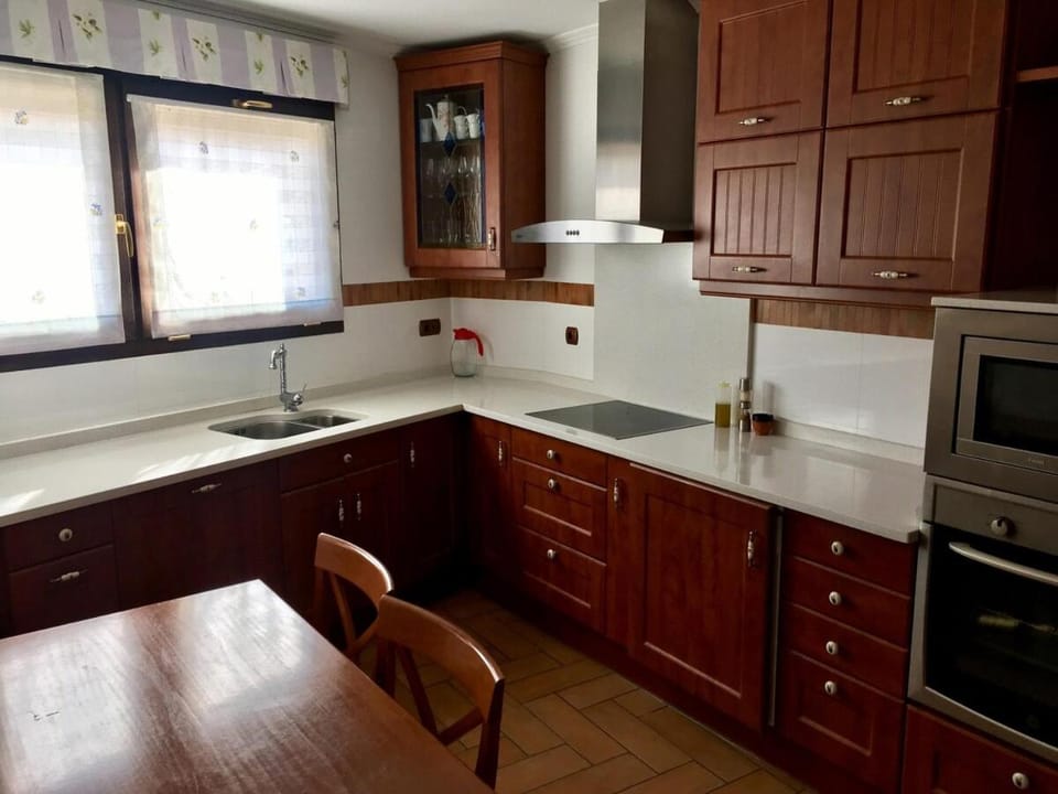 Kitchen or kitchenette, dishwasher, oven, stove