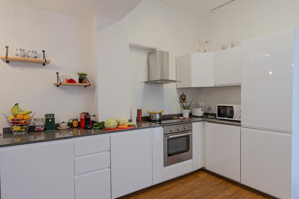 Kitchen or kitchenette, dishwasher, oven, stove, toaster