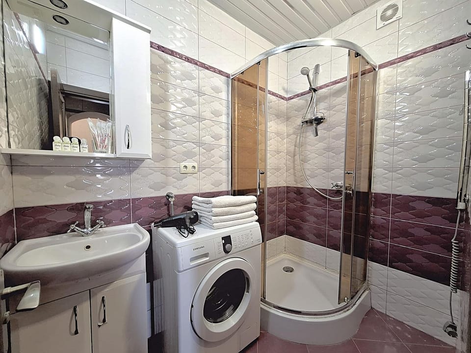 Shower, Toilet, Bathroom, Bath, hair dryier, towels, washing machine, dryer
