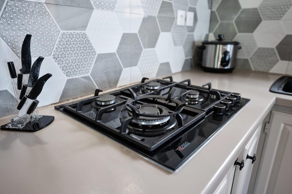 Bowling, microwave, oven, stove, toaster, kitchen