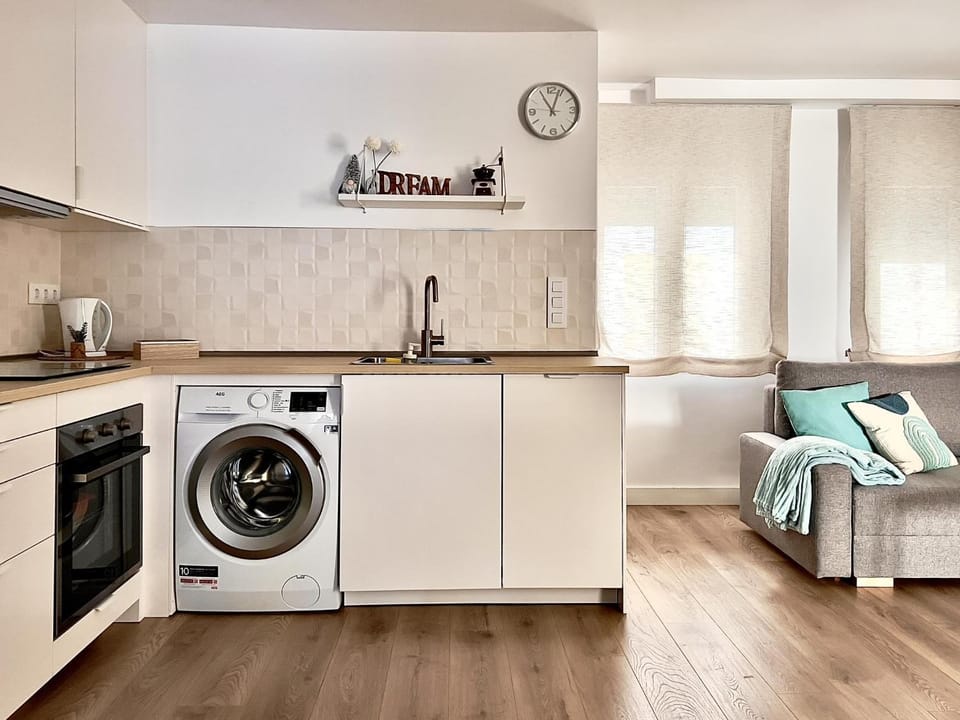 Kitchen or kitchenette, dishwasher, oven, stove, washing machine