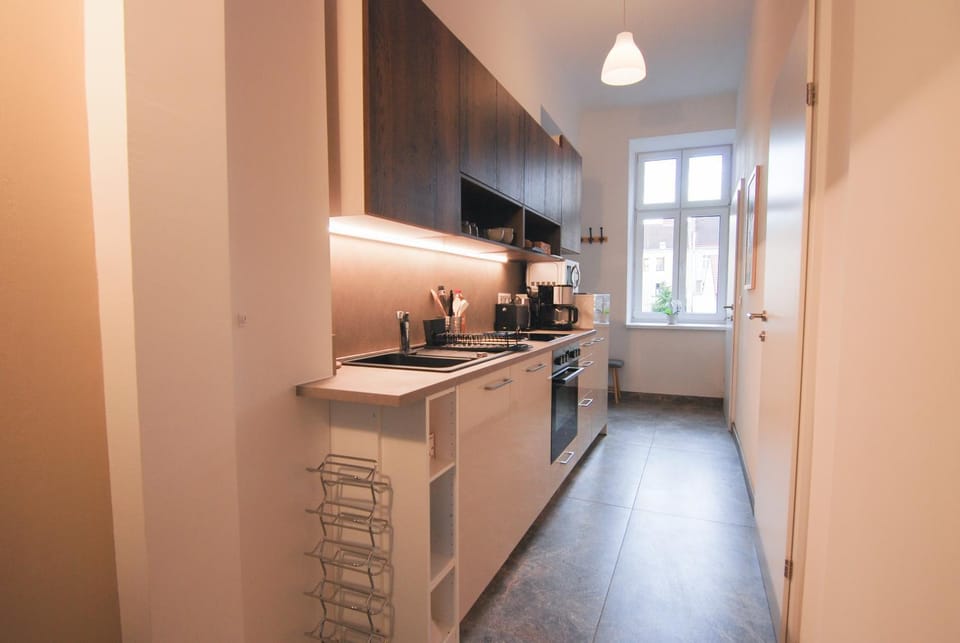 Kitchen or kitchenette, dishwasher, oven, stove