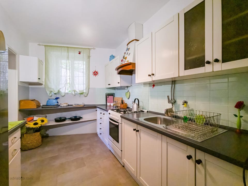 Kitchen or kitchenette, oven, stove, toaster