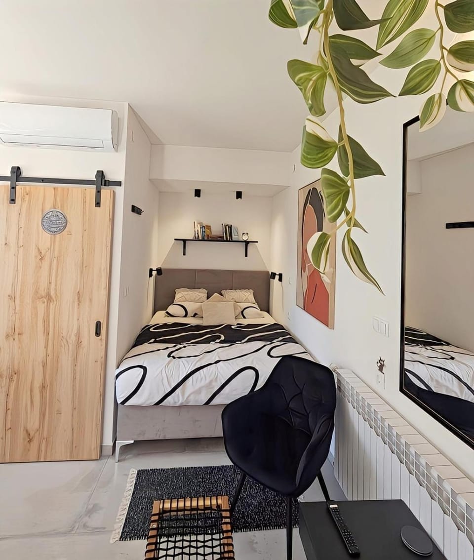 Bed, Living room, Seating area, Bedroom