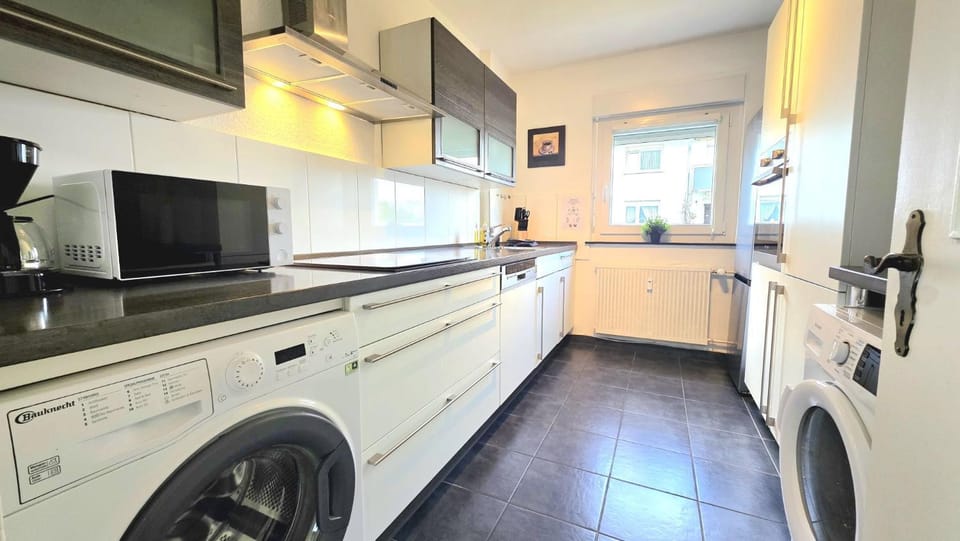 Kitchen or kitchenette, dishwasher, microwave, oven, washing machine, dryer