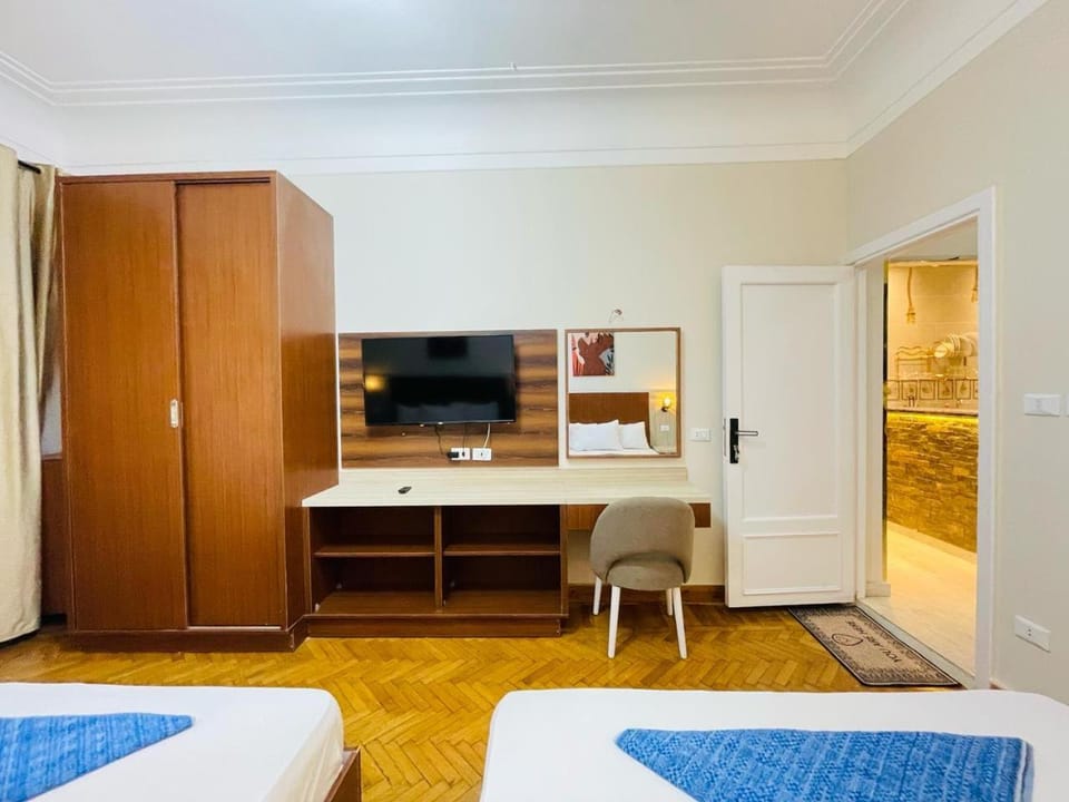 Communal lounge/ TV room, Bed, TV and multimedia, Living room, Photo of the whole room, Seating area, Evening entertainment, Bedroom, hair dresser, wardrobe
