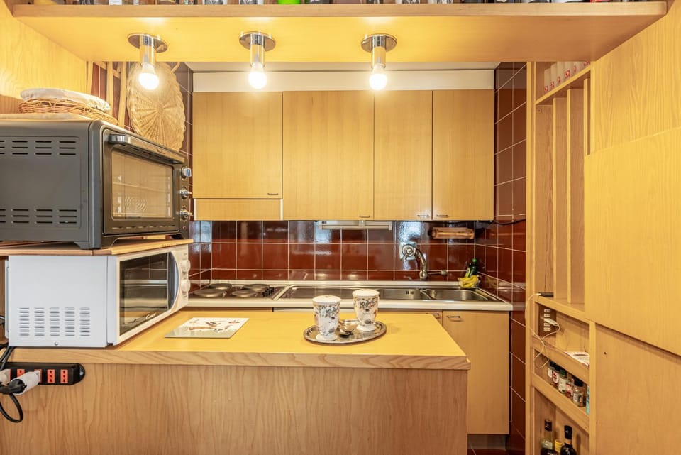 Kitchen or kitchenette, locker, microwave, oven, stove, kitchen