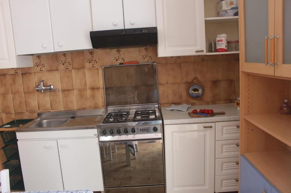 Kitchen or kitchenette, stove