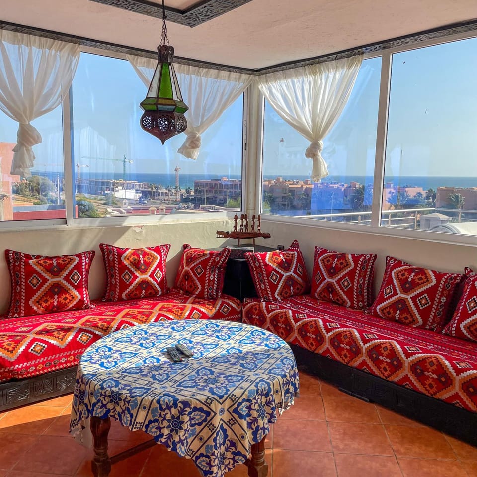Natural landscape, View (from property/room), Living room, Seating area, Beach, Beach, Sea view