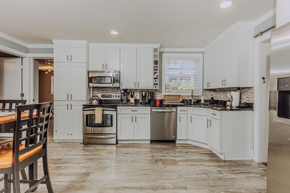 Kitchen or kitchenette, dishwasher, oven, stove