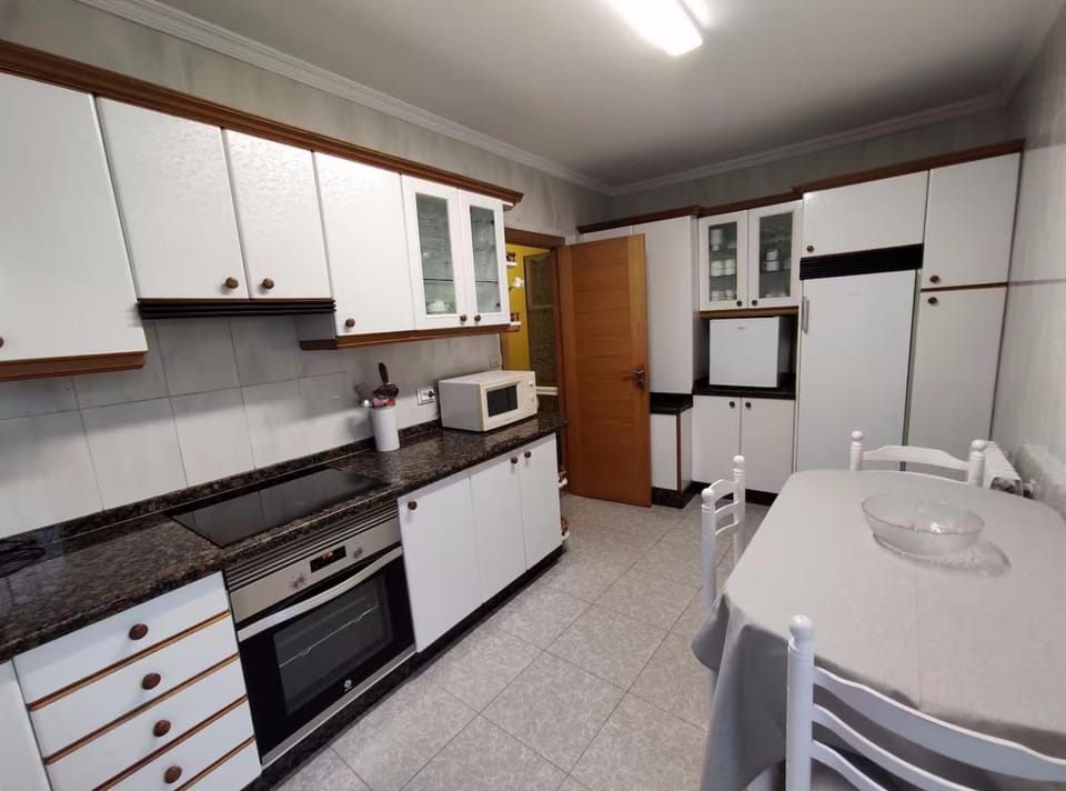 Kitchen or kitchenette, dishwasher, oven, stove, toaster