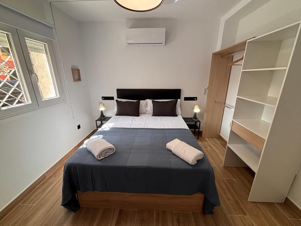 Bed, Photo of the whole room, Bedroom, towels, air conditioner