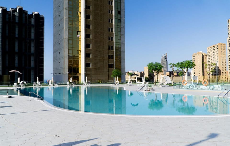 Property building, Day, Pool view, Swimming pool, sunbed