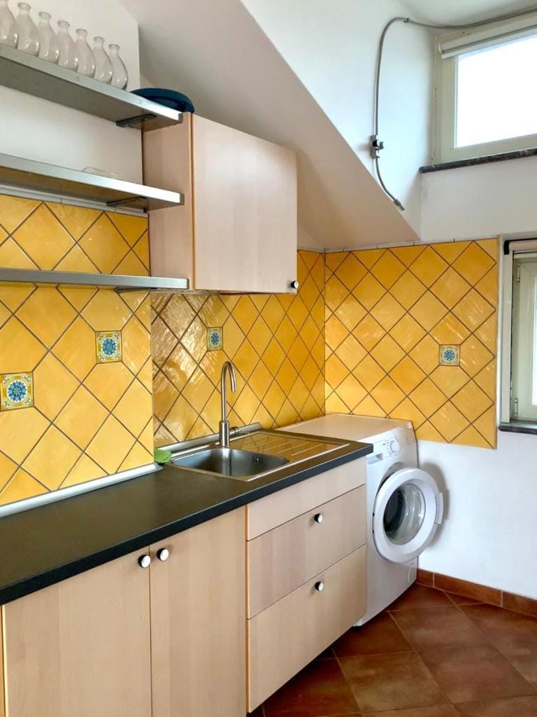 Kitchen or kitchenette, stove, washing machine