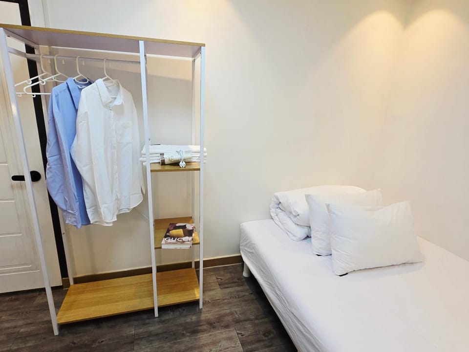 Bed, Photo of the whole room, hair dryier, towels, wardrobe