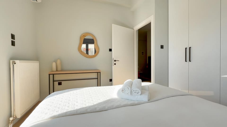 Bed, towels, wardrobe
