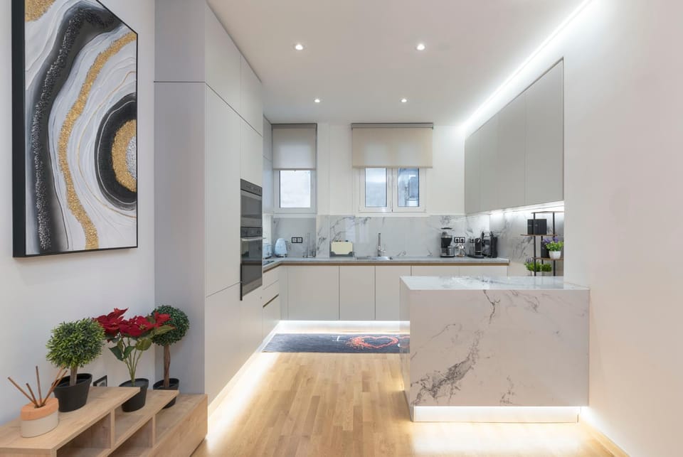 Kitchen or kitchenette, dishwasher, oven, stove