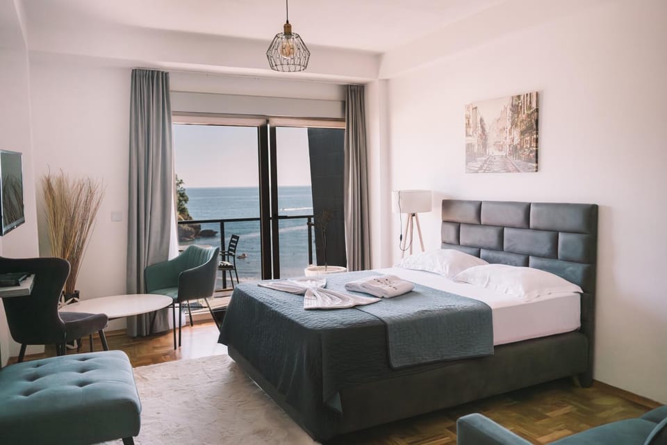 Bed, View (from property/room), View (from property/room), Living room, Photo of the whole room, Seating area, Beach, Beach, Bedroom, City view, City view, Lake view, Sea view, Sea view, towels
