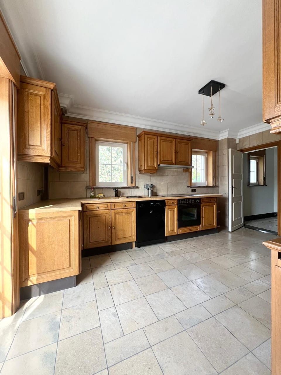 Kitchen or kitchenette, dishwasher, oven, stove