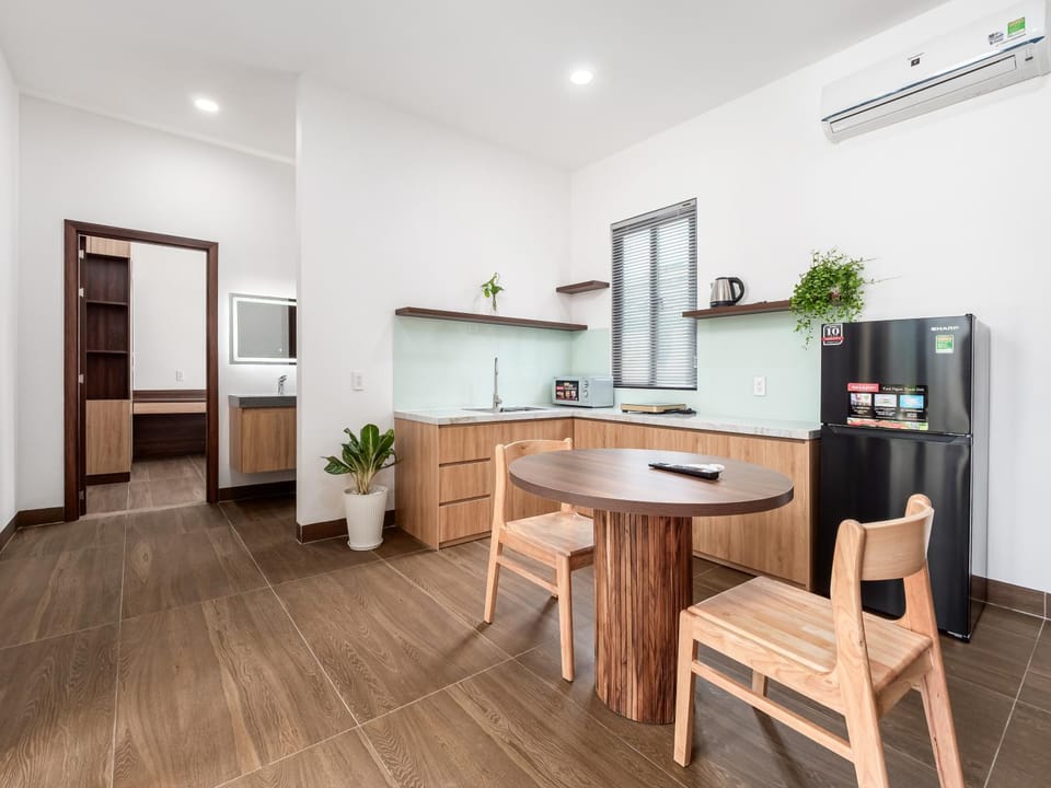 Kitchen or kitchenette, stove, air conditioner
