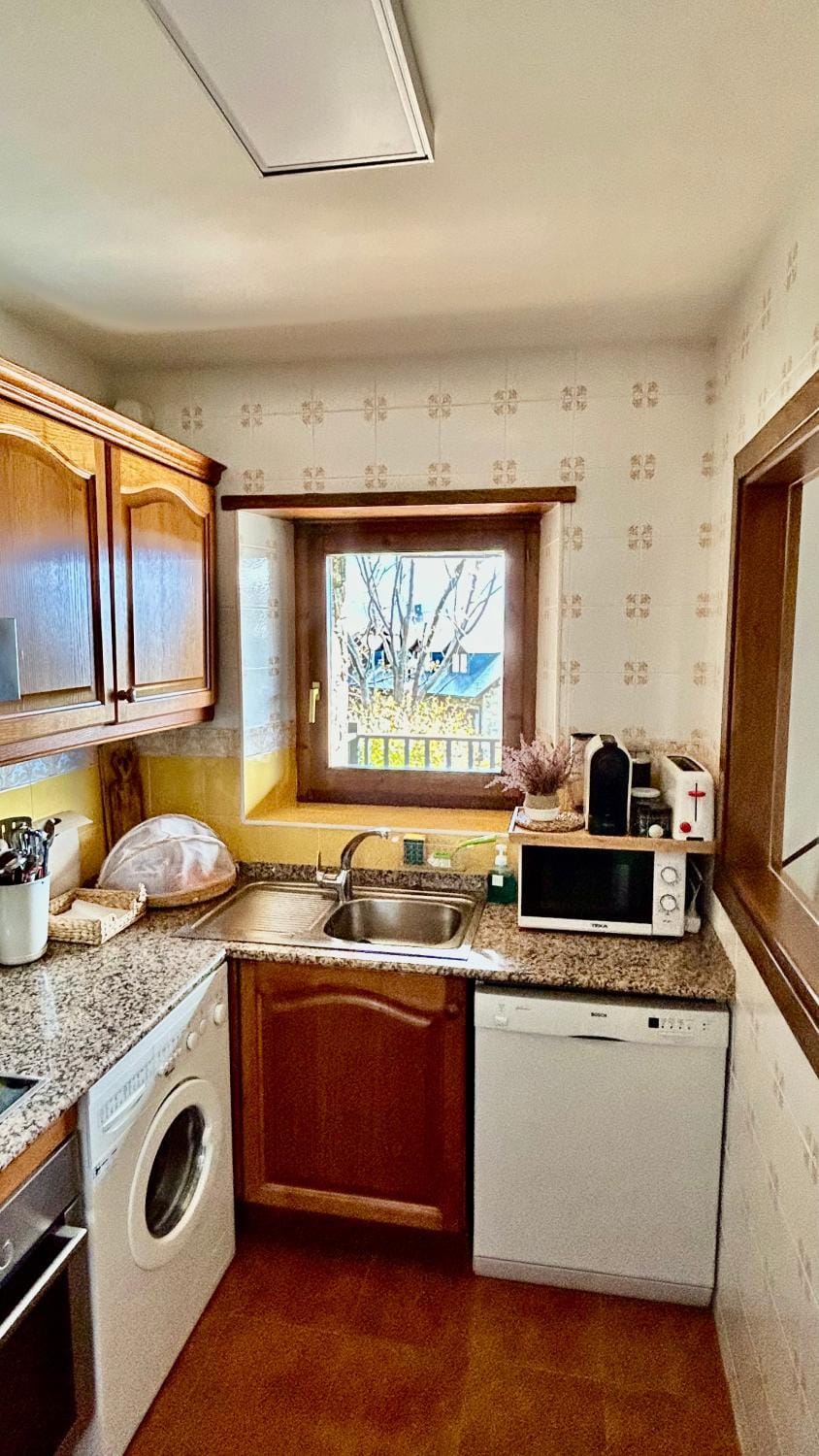 Kitchen or kitchenette, dishwasher, microwave, toaster, washing machine