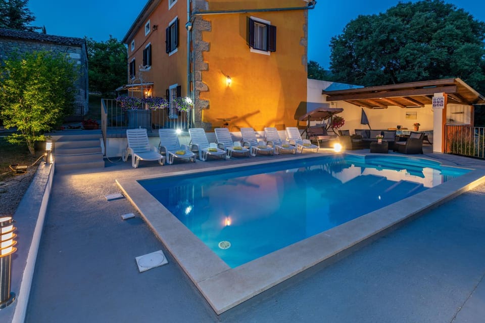 Property building, Patio, Night, Pool view, Swimming pool, sunbed