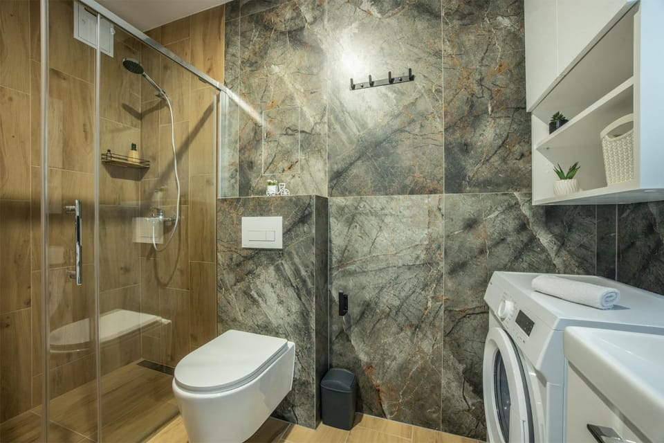 Shower, Toilet, Bathroom, towels, washing machine, dryer