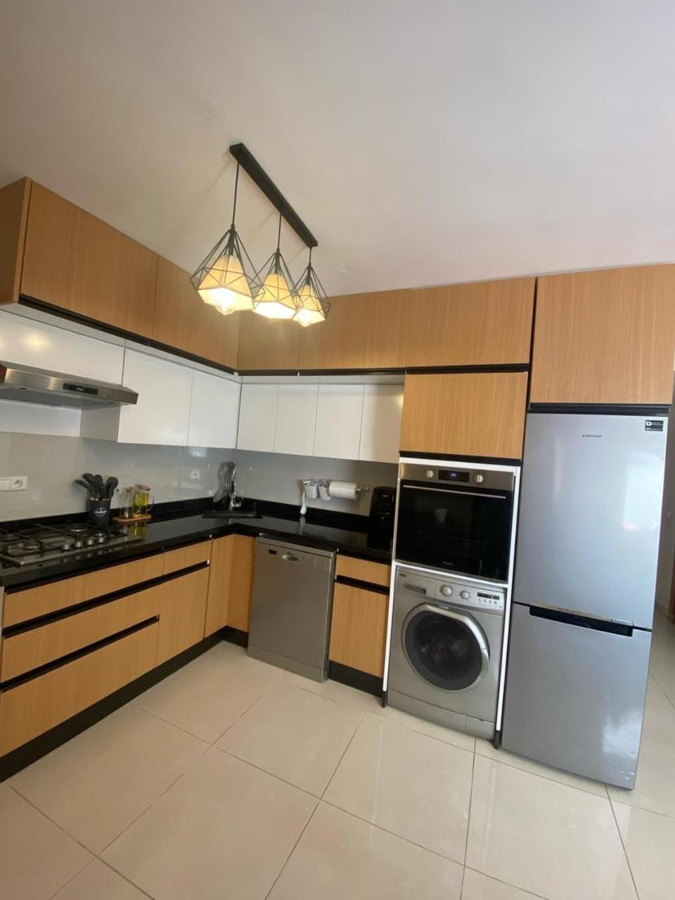 Kitchen or kitchenette, dishwasher, oven, stove, washing machine