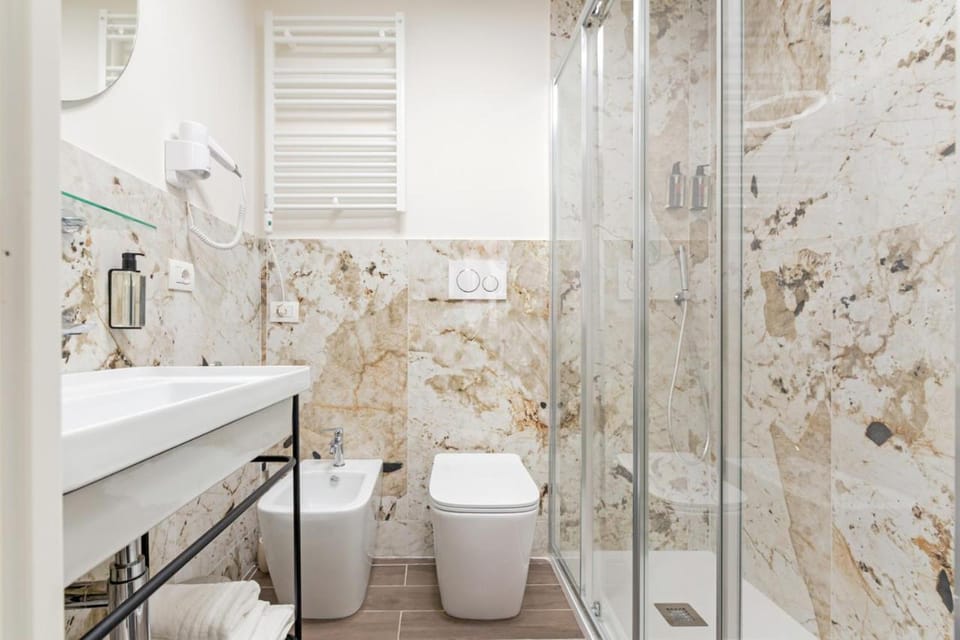 Shower, Bathroom, bidet, hair dryier, towels