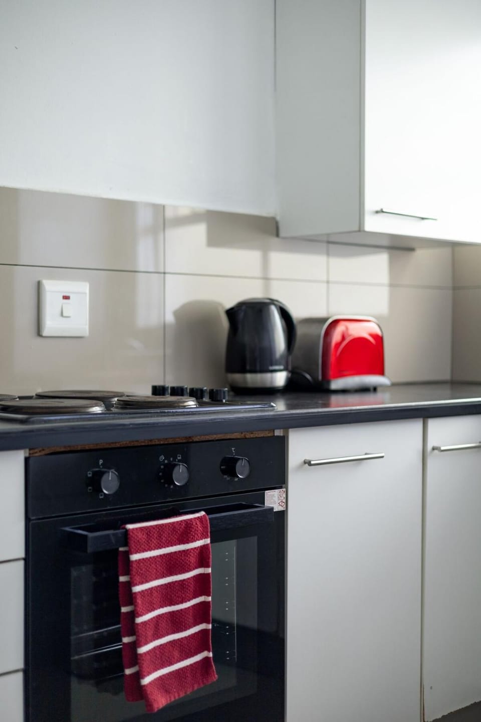 Kitchen or kitchenette, stove, toaster