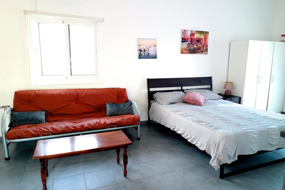 Bed, Seating area, wardrobe