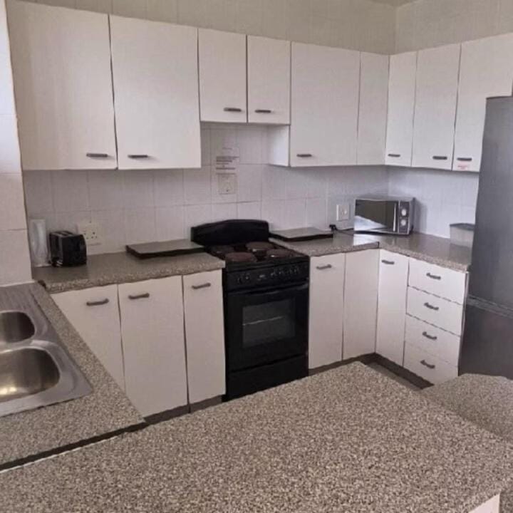 Kitchen or kitchenette, stove, toaster