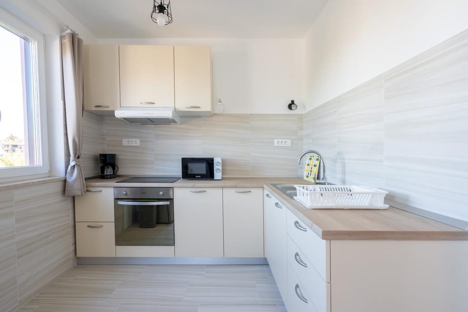 Kitchen or kitchenette, microwave, oven, stove, toaster