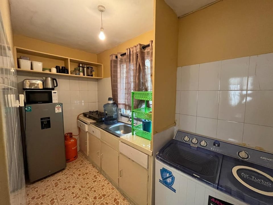 Kitchen or kitchenette, stove, washing machine