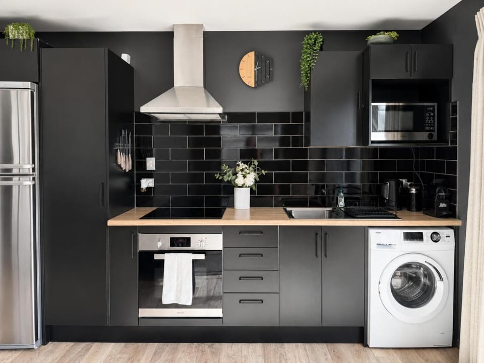 Kitchen or kitchenette, oven, stove, washing machine