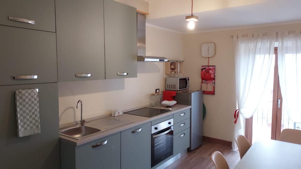 Kitchen or kitchenette, dishwasher, oven, stove