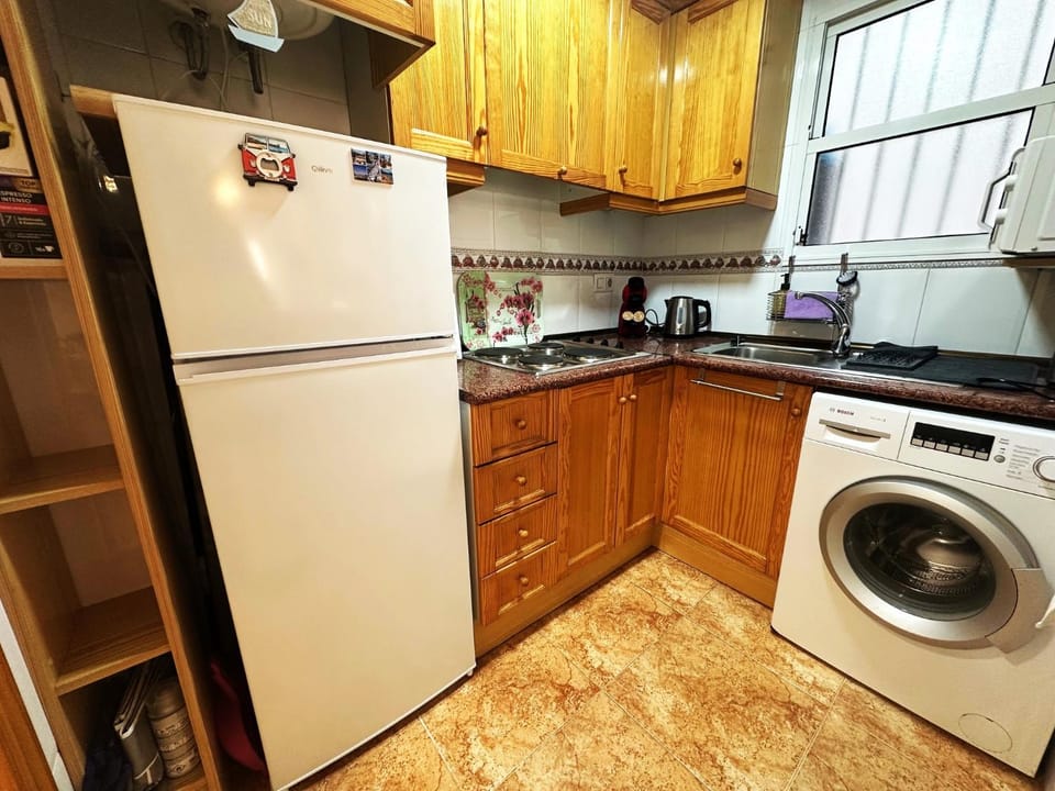 Kitchen or kitchenette, washing machine