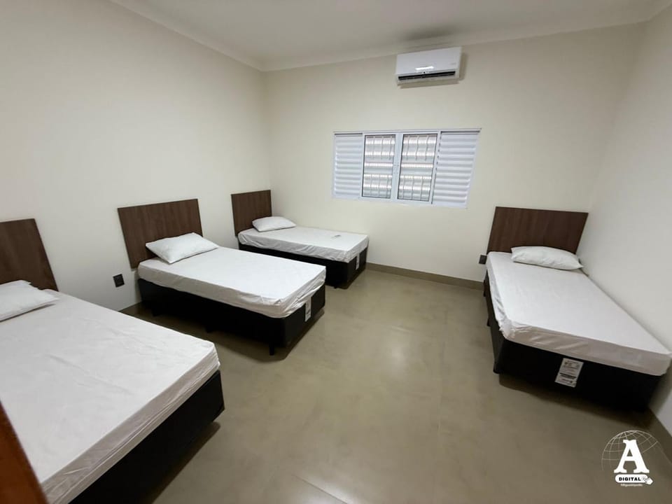 Bed, Text overlay, air conditioner