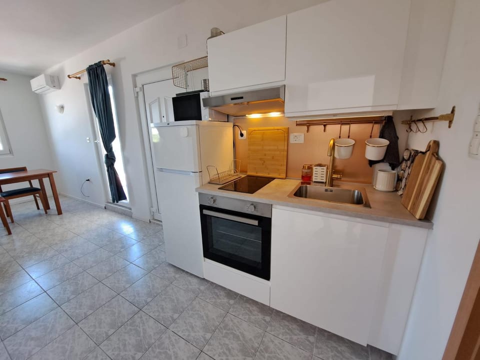 Kitchen or kitchenette, oven, stove, toaster