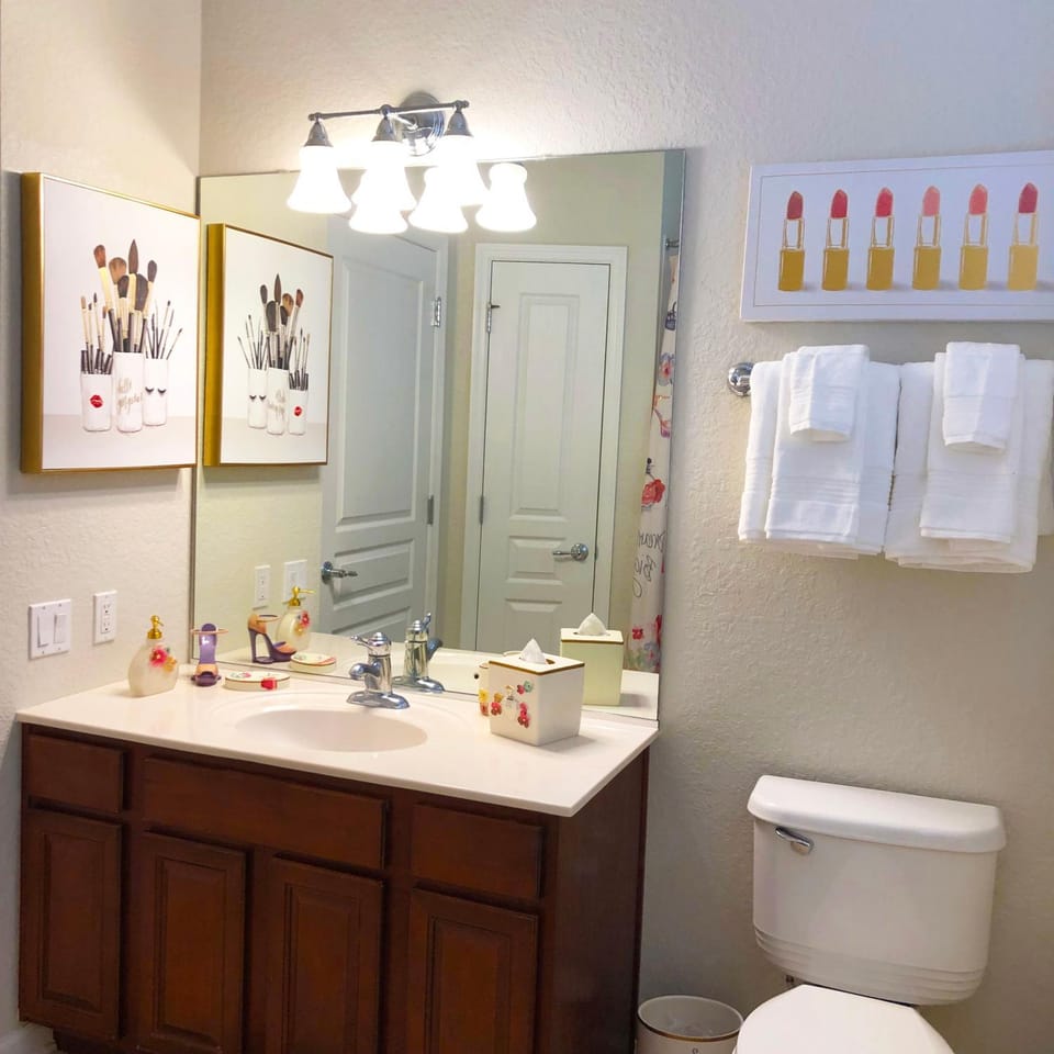 Shower, Toilet, Bathroom, Decorative detail, hair dryier, towels, air conditioner