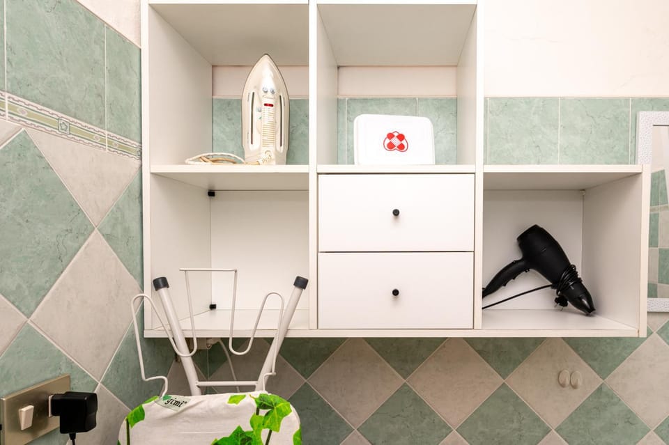 Bathroom, flat iron, hair dryier, wardrobe