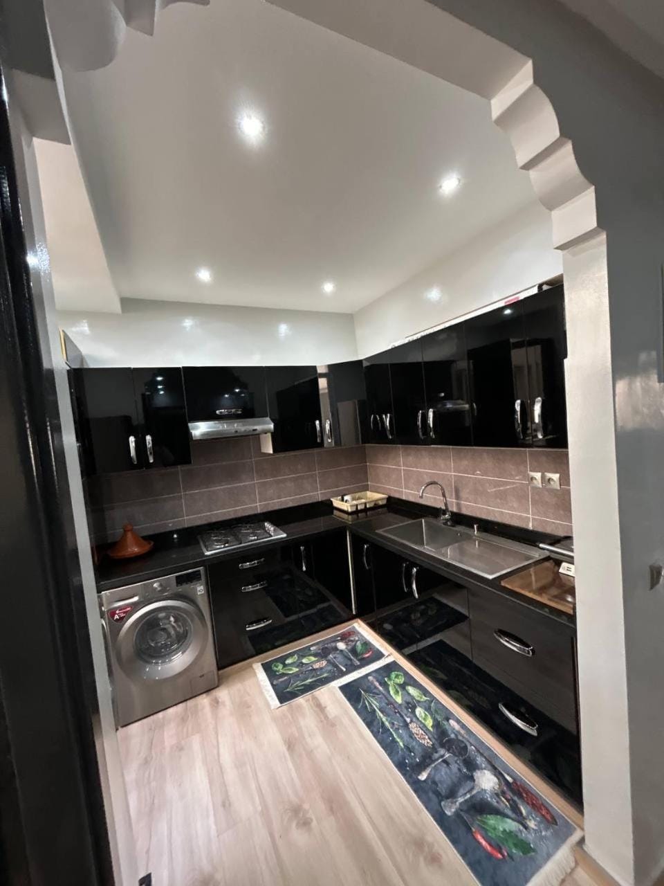 Kitchen or kitchenette, dishwasher, stove, washing machine
