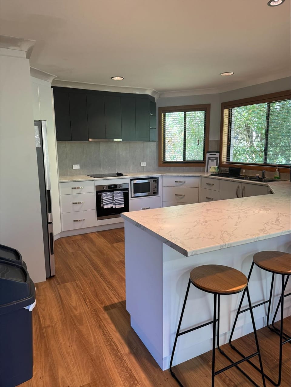 Kitchen or kitchenette, dishwasher, oven, stove